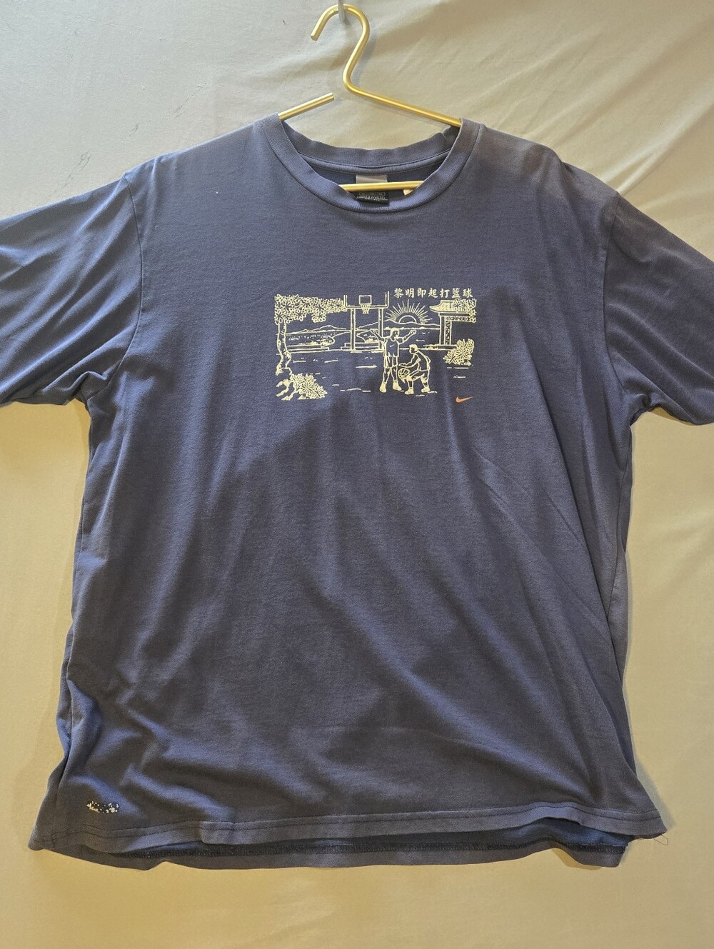 Nike Men's Blue Short-Sleeve Basketball Graphic Tee with Cream Print